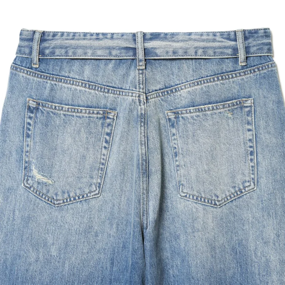 2026 new women's clothing French casual design with perforated details, mid waist folding waist jeans