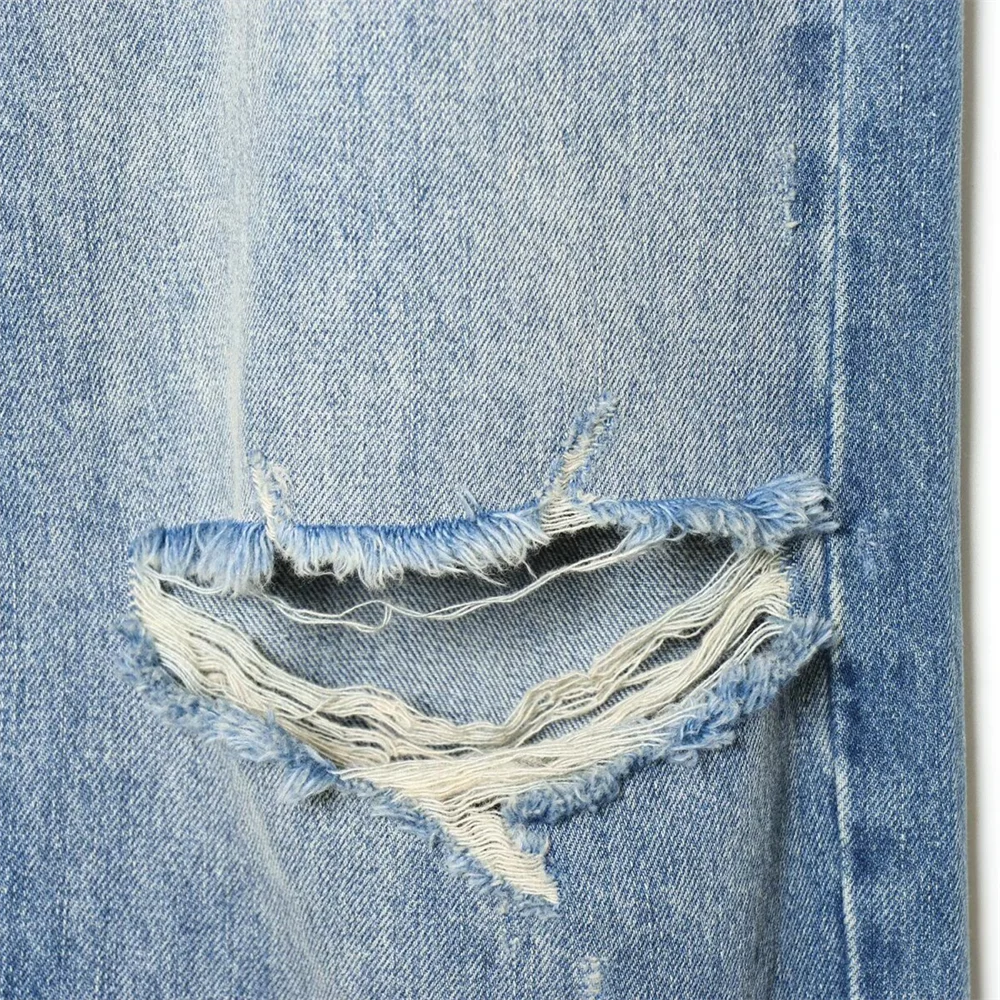 2026 new women's clothing French casual design with perforated details, mid waist folding waist jeans