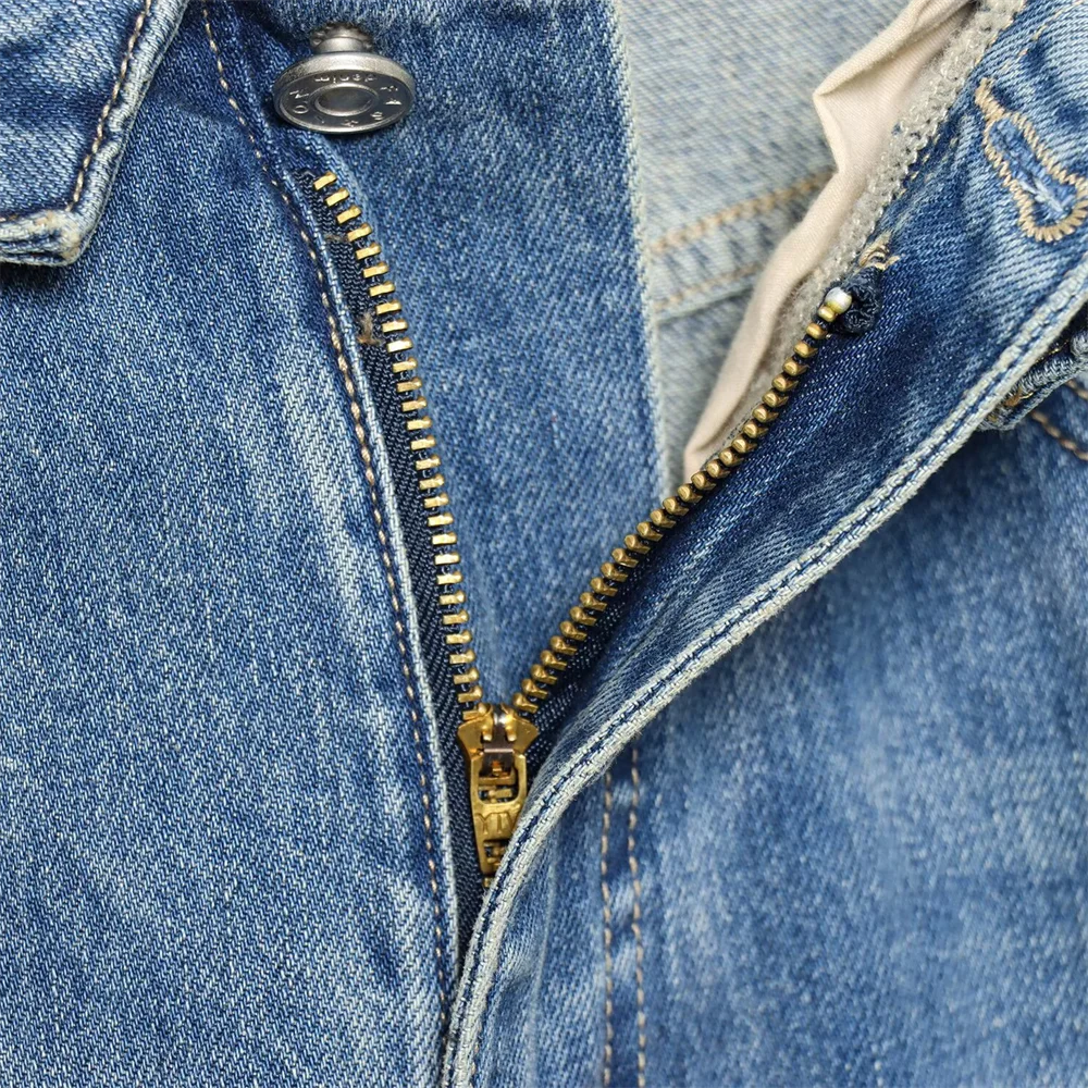 2026 new women's clothing French casual design with perforated details, mid waist folding waist jeans