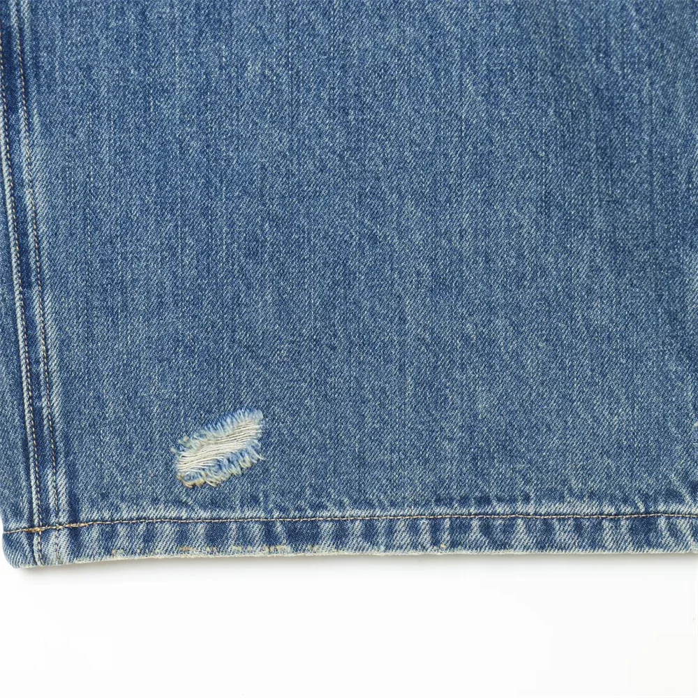 2026 new women's clothing French casual design with perforated details, mid waist folding waist jeans